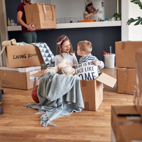 Brother And Sister Playing In Empty Cardboard Box Move Picture Id1344286727